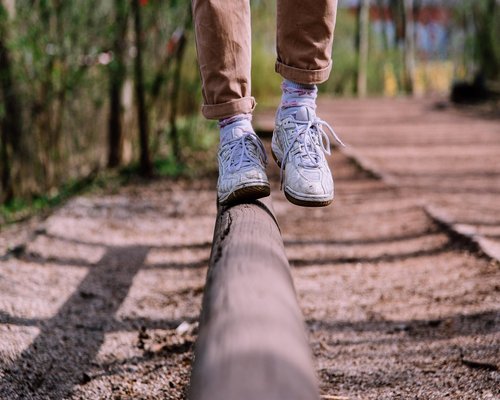 Close up of a person taking off tight shoes after a long day at work